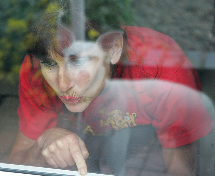Marjorie Looking Out Window at Blue Looking In