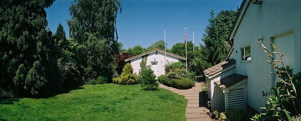 Panoramic view of dog kennel and garage